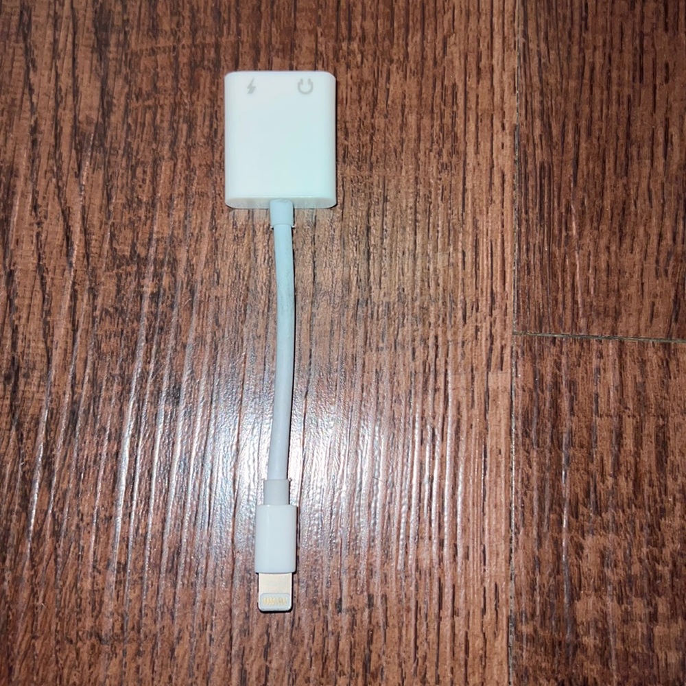 Iphone Headphone and charger adapter. 2 in 1. In good condition.